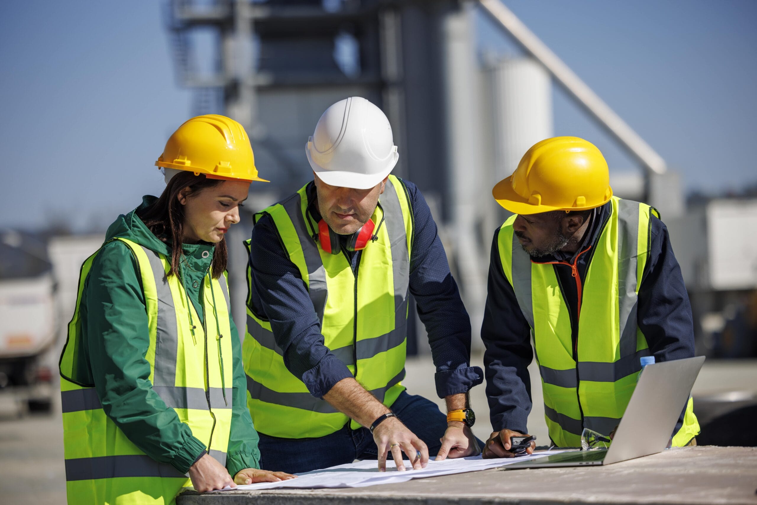 Construction team reviews plans