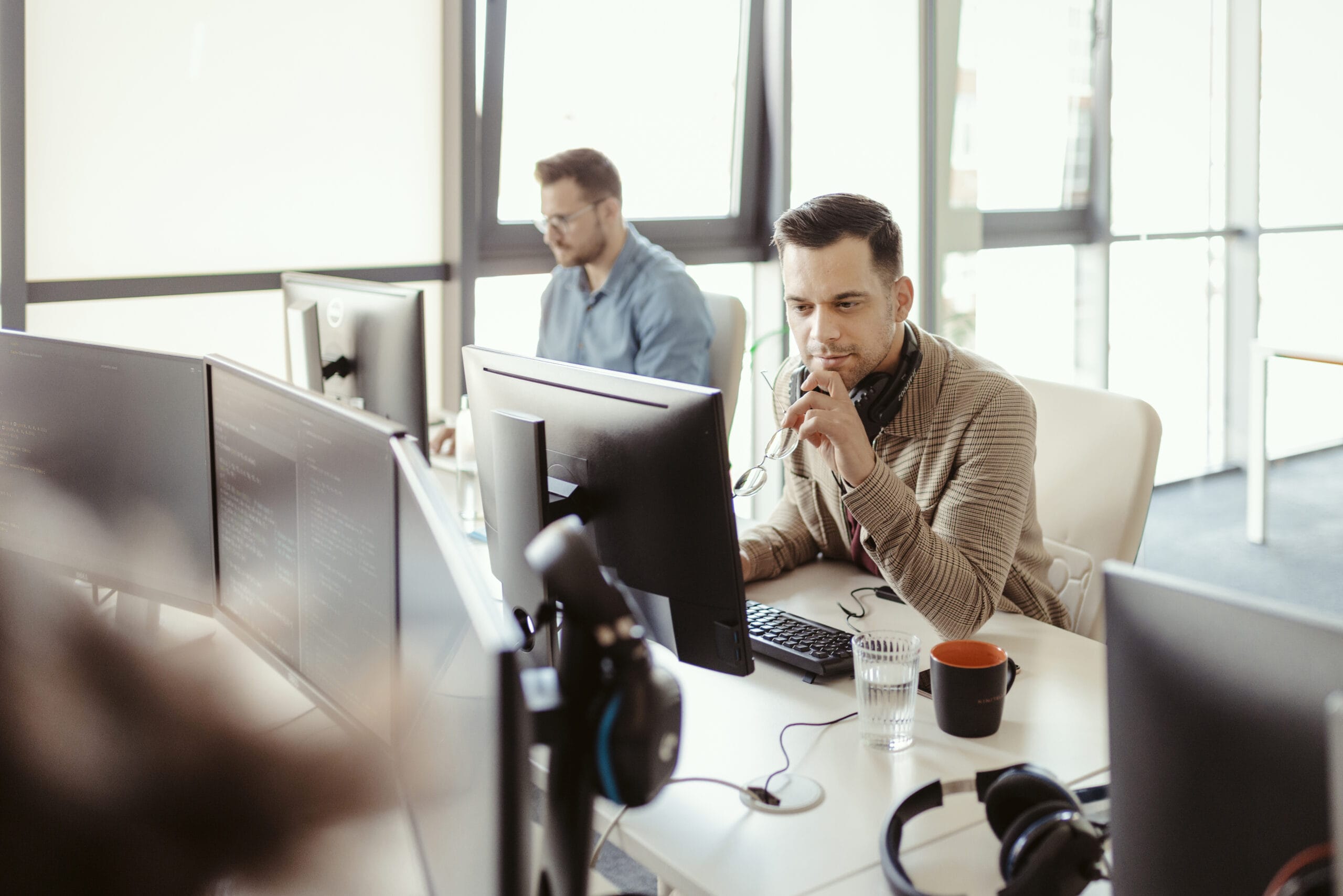 Professional working on a device doing data migrations.