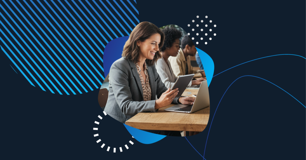 Business professionals representing nonprofit organizations collaborate using laptops and tablets, symbolizing digital transformation and technology adoption in the nonprofit sector.